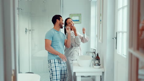 Dance,-happy-and-a-couple-brushing-teeth