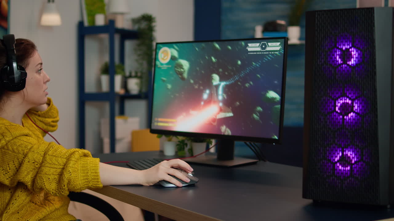 Focused woman gamer sitting on desk, putting on headset