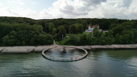 aerial ascent of the infinity bridge and varna castle, aarhus, denmark