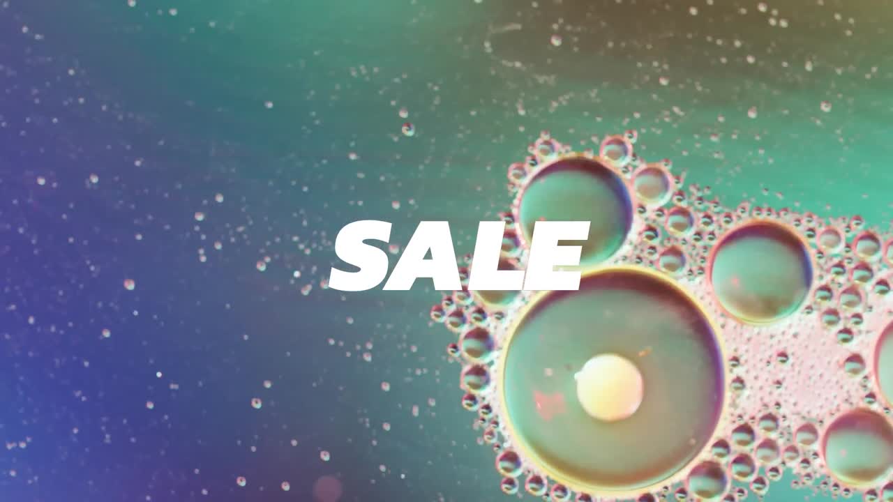 액체 및 baubles의 클로즈업 위에 판매 텍스트의 애니메이션