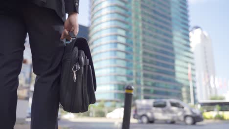 businessman waiting on the street in the city center.