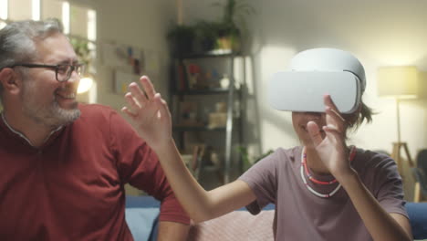 father and daughter enjoying virtual reality together at home