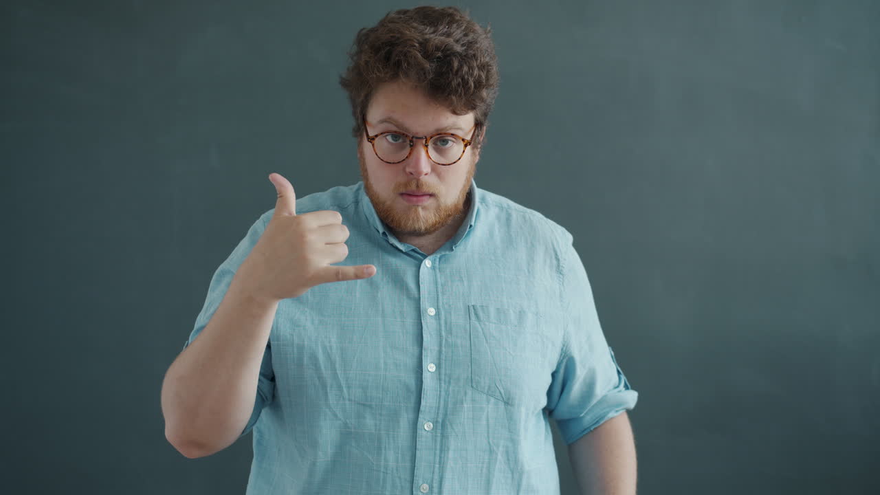 Man gesturing to call