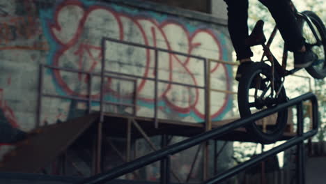 biker making tricks at skatepark. active rider racing on bicycle for leisure.