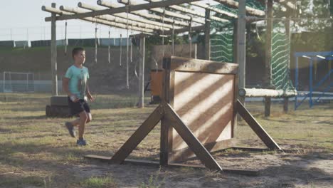 caucasian boy training at boot camp