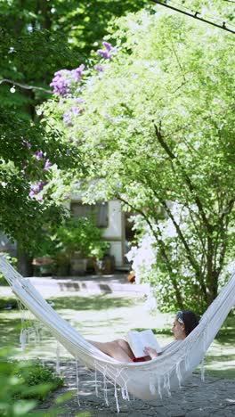 woman relaxing in a hammock in a garden