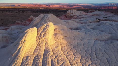 Rough-terrain-with-scenic-cliffs-and-sandy-desert-at-sundown-in-USA