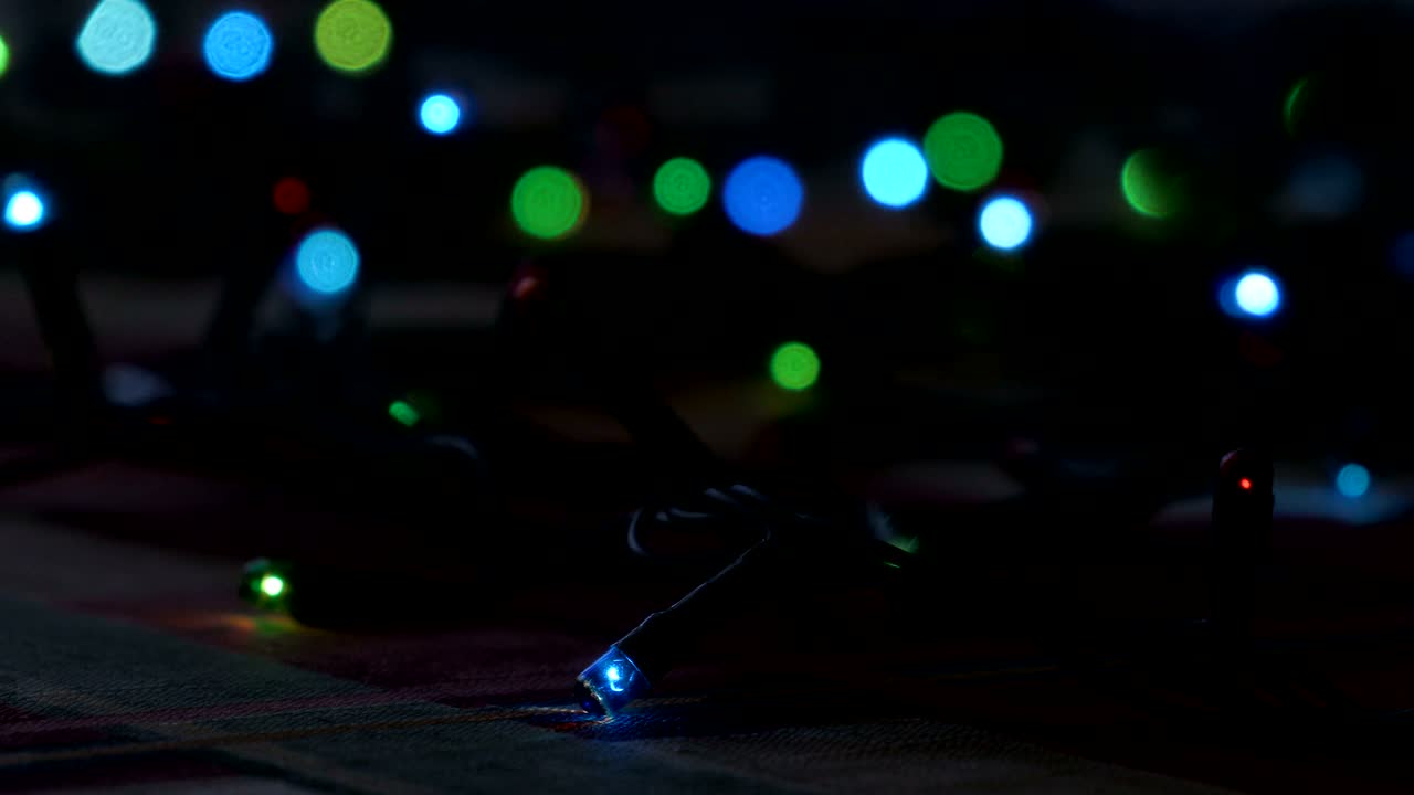 Blue, red and green lights for Christmas tree electric lights. Footage clip 4k