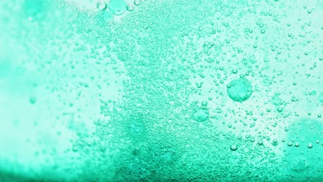 macro-shot-of-bright-blue-water-with-many-sparkling-bubbles
