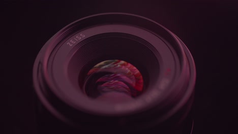 detailed artistic shot of modern photography lens with beautiful reflections depicting lens glass and coating