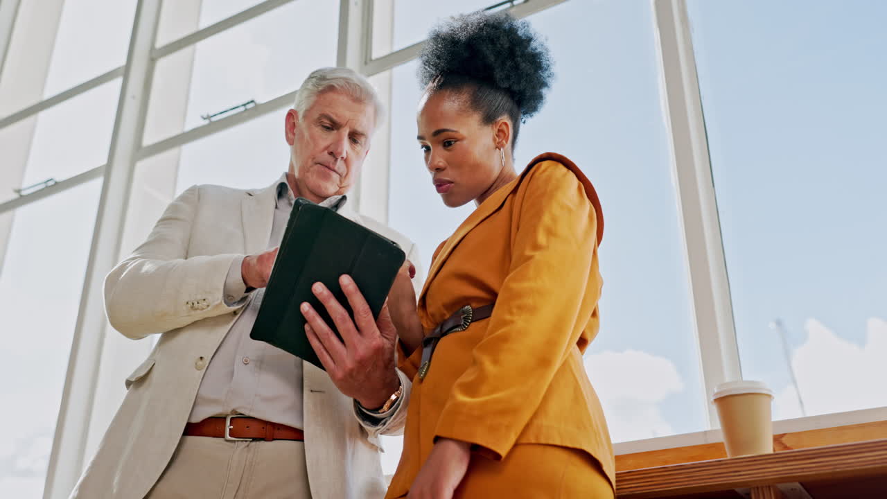 Senior executive man, black woman