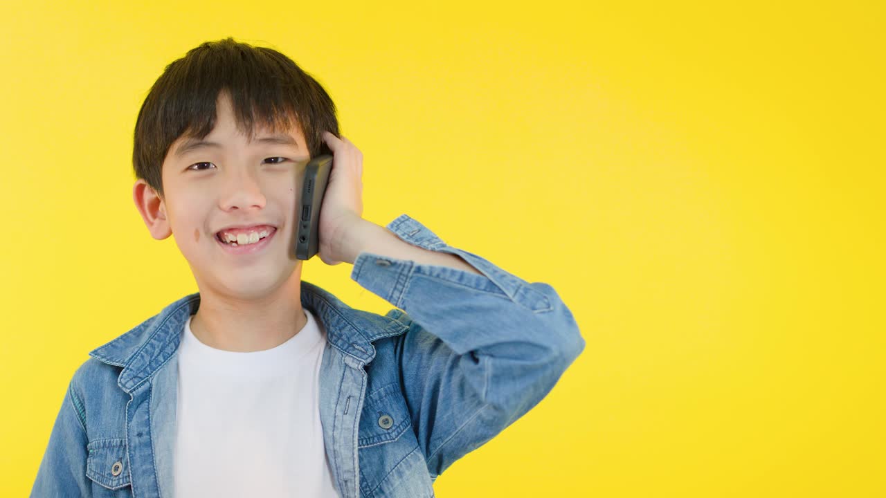 Boy talking on phone