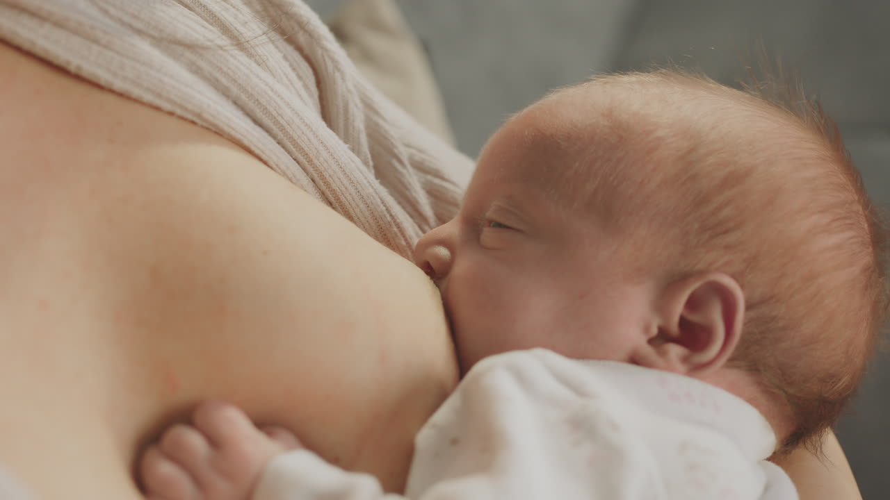 Mother breastfeeding her newborn baby