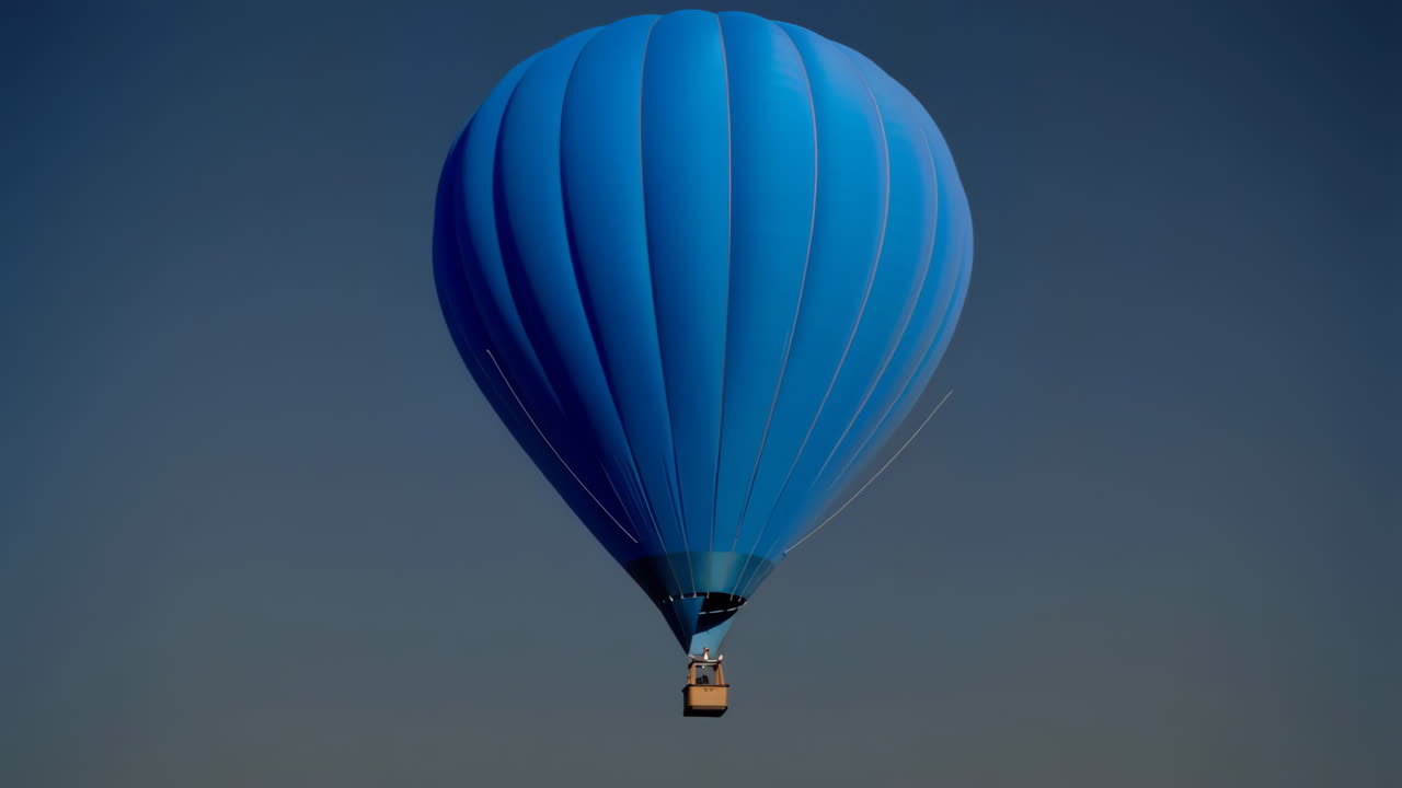 Blue Hot Air Balloon Against a Dark Sky