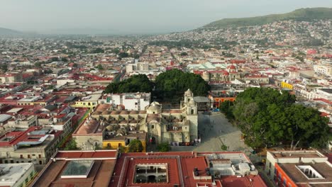drone: lateral shot of a temple in oaxaca in the early morning