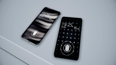 two black smartphones with fingerprint scanners