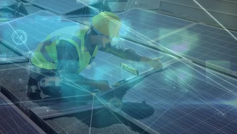 animation of network of connections over solar panels and caucasian male engineer