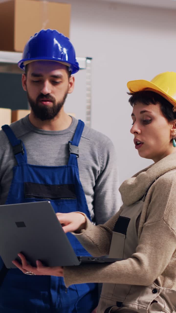 Vertical video: Diverse employees talking about stock logistics in depot