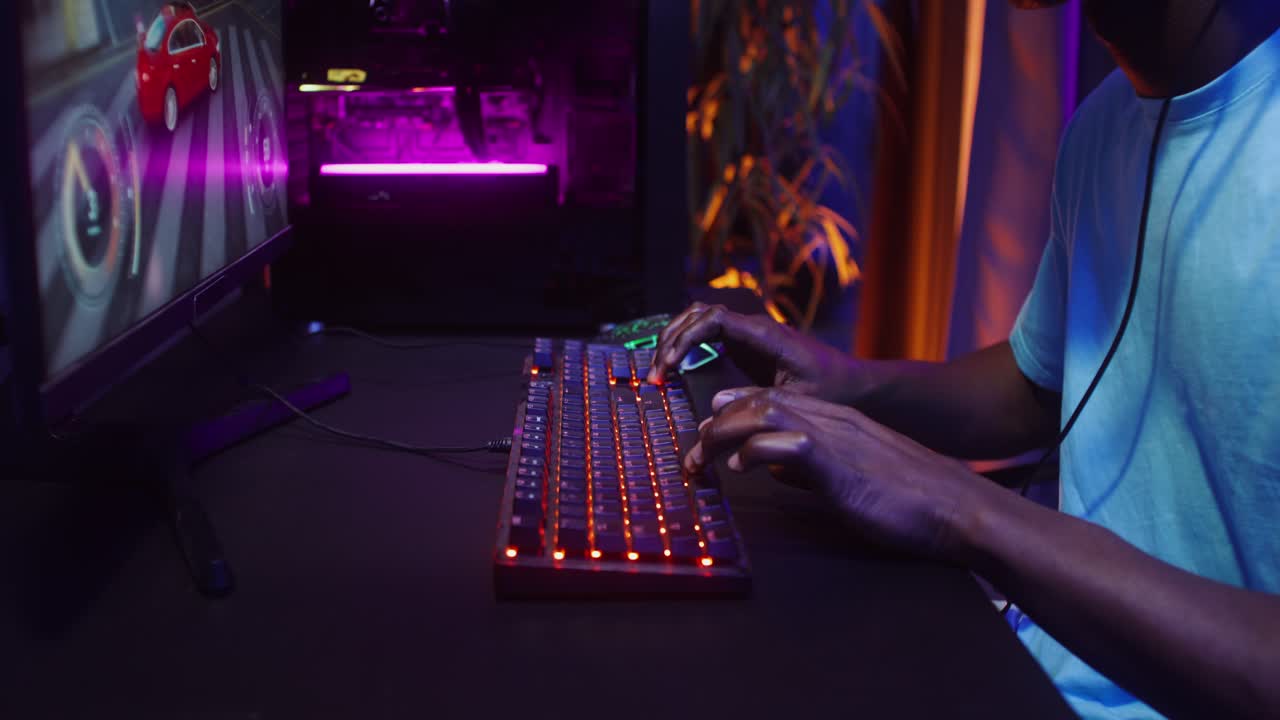 Gamer playing video game on computer