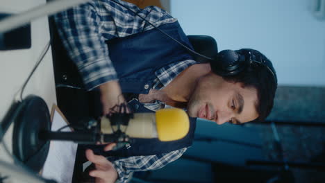 man recording a podcast or radio show