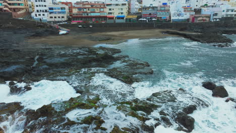 aerial view over el puertillo beach in the municipality of arucas and strong waves