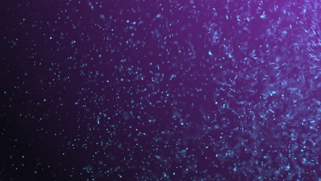 animación digital de partículas brillantes en azul y púrpura en un bucle.