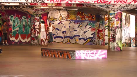 skateboarders performing tricks in urban skatepark