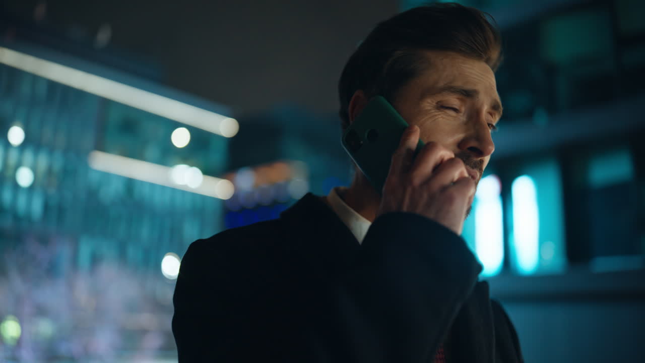 Disappointed boss complaining mobile phone call at night city view portrait