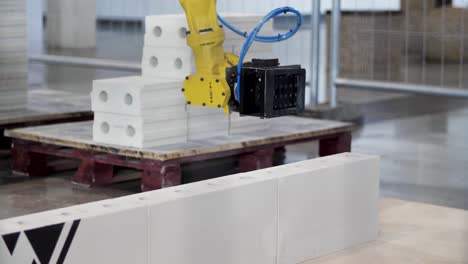 robotic arm building with pre-fabricated bricks