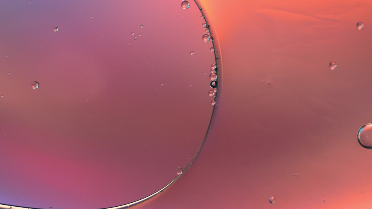 물 위에 떠다니는 기름방울의 다채로운 예술적. 추상적인 거품 배경