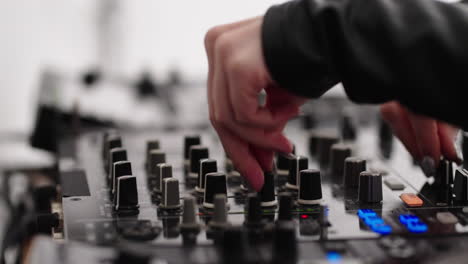 dj mixing music on a console