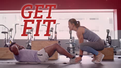 animation of get fit text over diverse man and woman exercising in gym