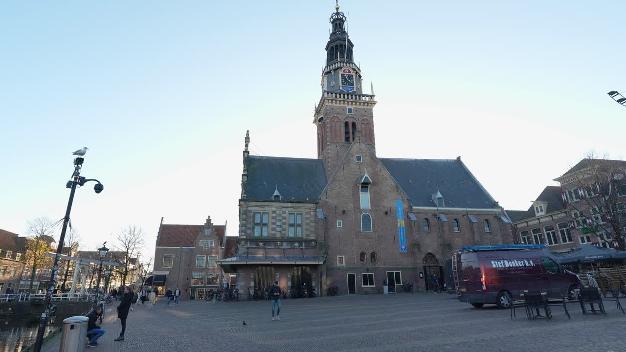 Panning view of the Waagplein including ,the Weighhouse with tower, Alkmaar city center.