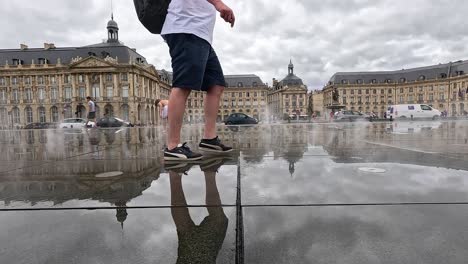 people walking on reflective surface in bordeaux