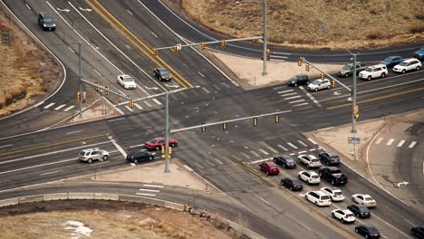 Aerial-time-lapse-of-car-traffic-at-an-intersection