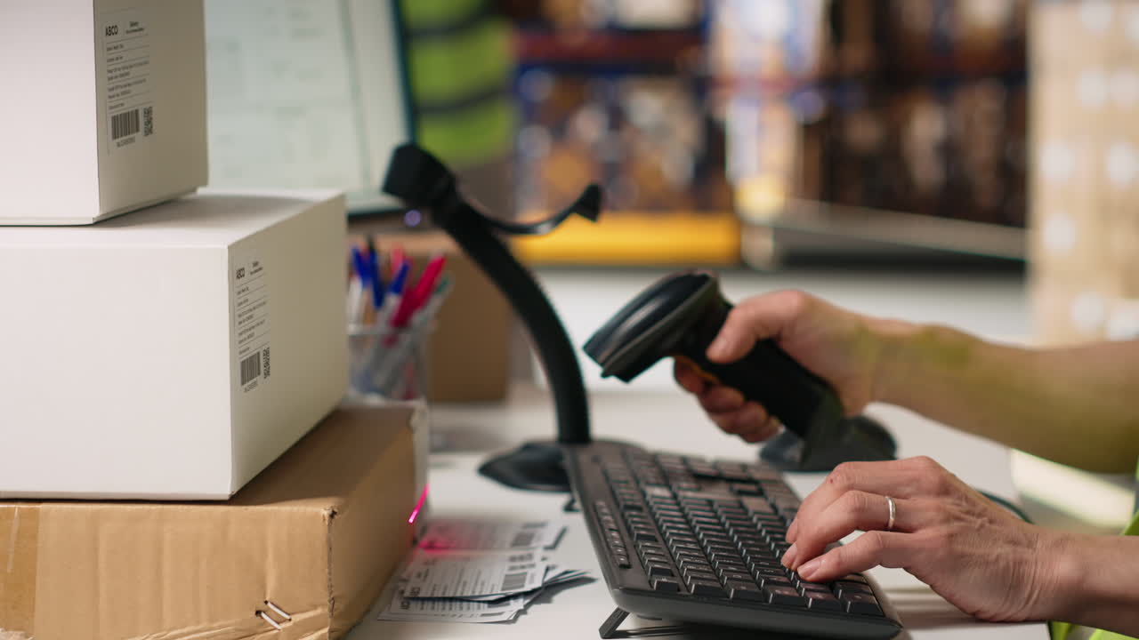 Vertical Video Asian male staff uses handheld scanner to register airway bill information