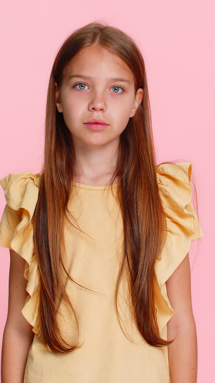 Child girl kid showing victory win gesture while happily and joyfully celebrating success with smile