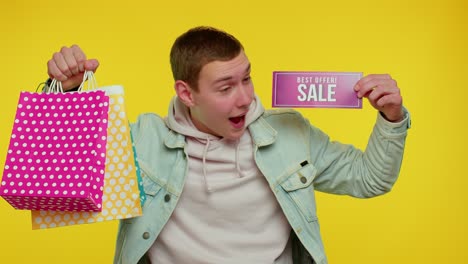 happy student man showing sale inscription banner text, advertising discounts low holidays prices