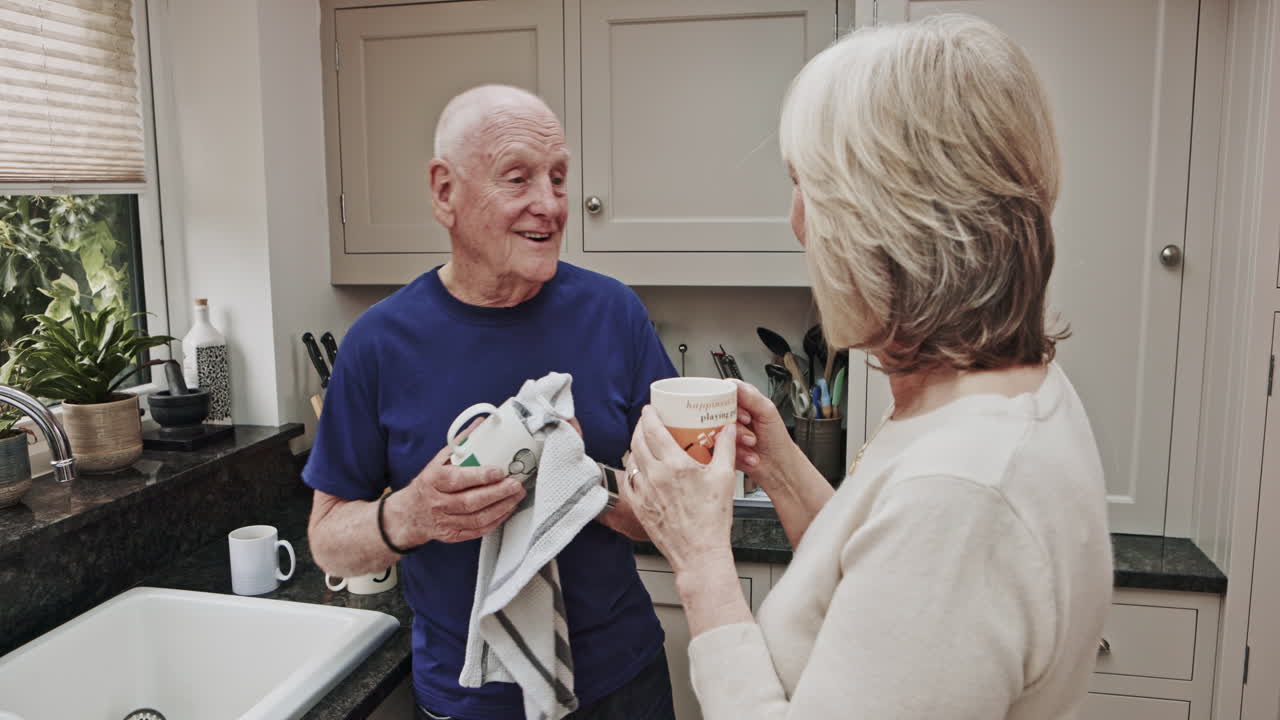 Senior couple chatting in the kitchen