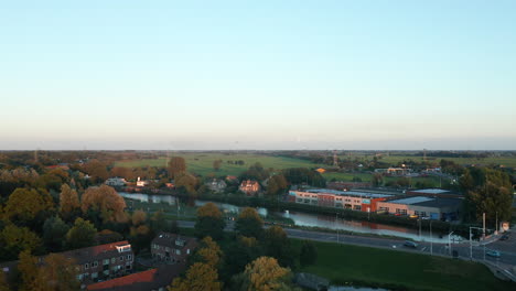 panorama of a calm waterscape of gouwe river in the rural area of gouda, netherlands