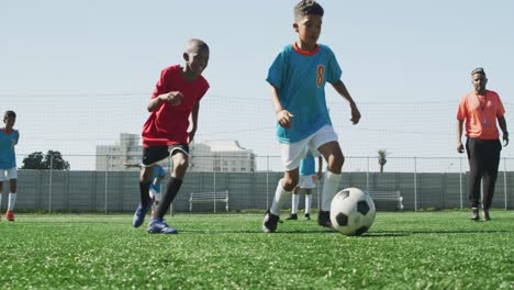 soccer kids playing in a sunny day