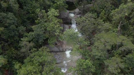 cascade of josephine falls in wooroonooran national park in cairns region far north queensland, australia - aerial drone shot