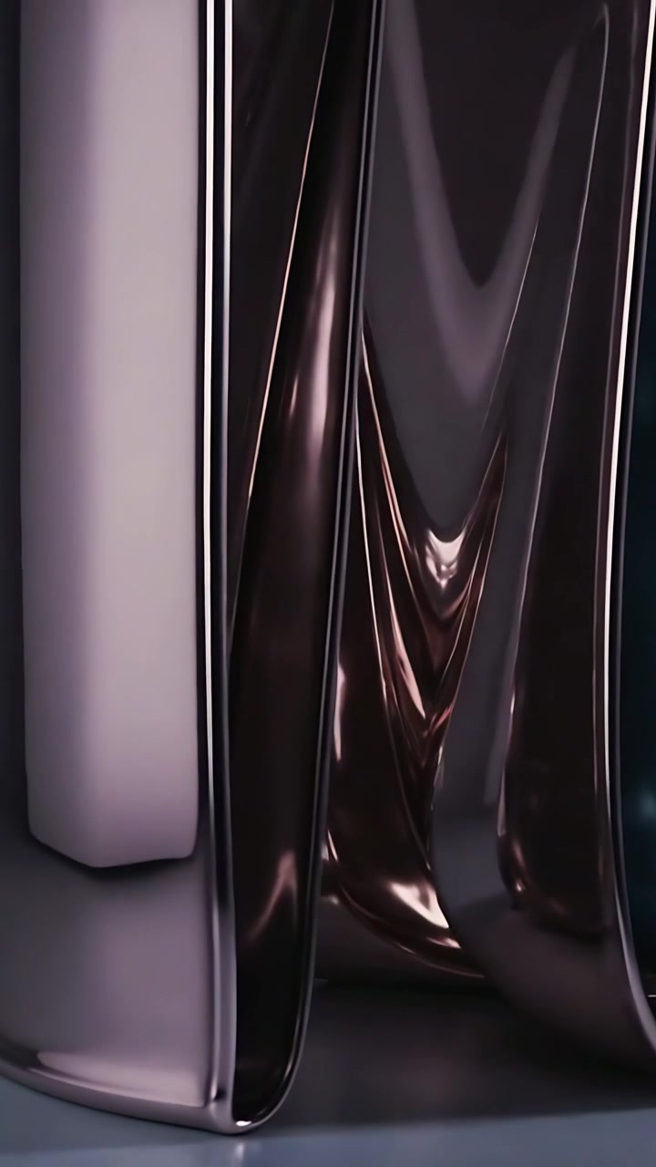 Vertical video: Camera tracking chrome columns on table, exposing curved base, vase, box highlight