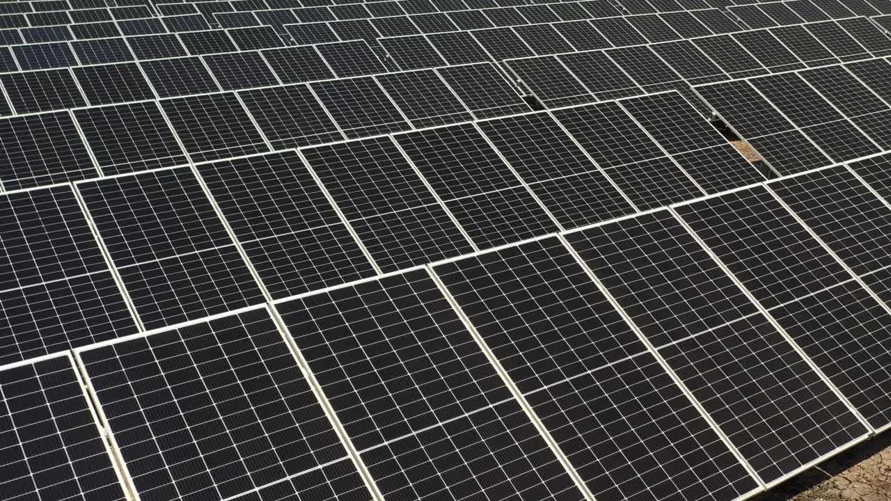 aerial view of photovoltic solar panels convert sunlight into electricity.4k video