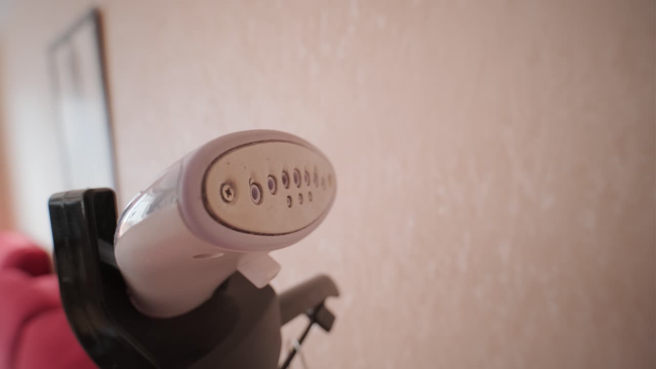 Close Up of Garment Steamer Emitting Steam