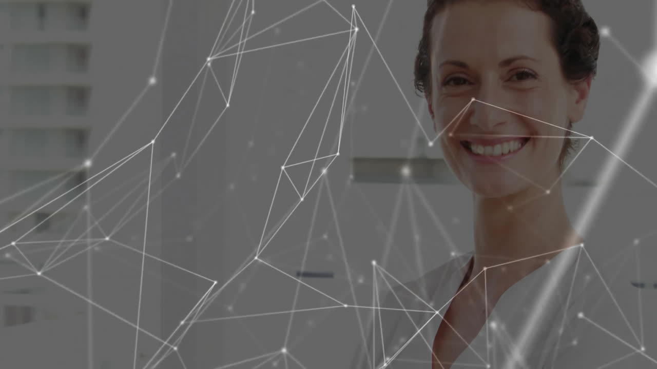 Smiling woman standing in modern office, presenting glowing network mesh overlay for technology