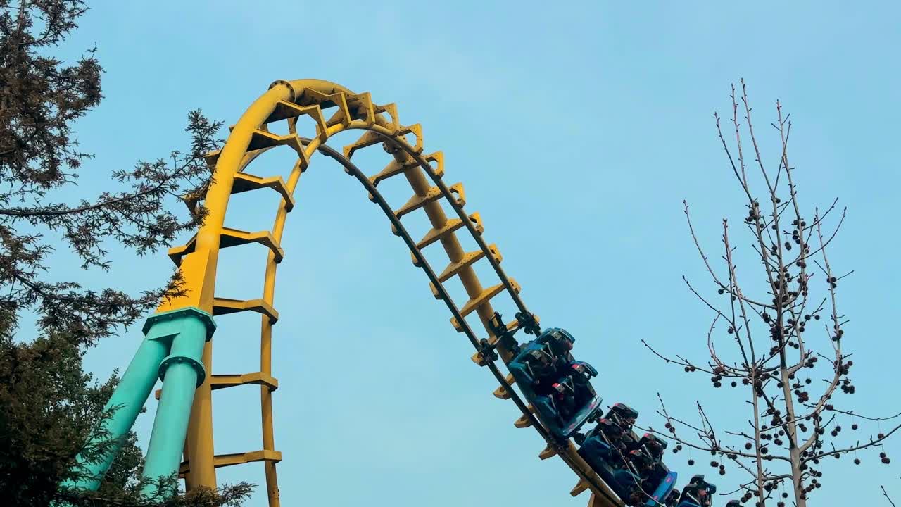 People riding a rollercoaster at the Fantasilandia amusement park, in Santiago, Chile