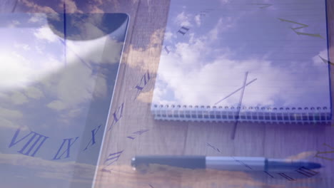 time theme being visualized in overhead desk, with notebook, pen, tablet, floating roman numerals