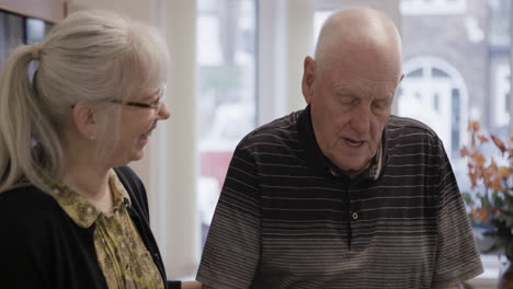 elderly couple in conversation