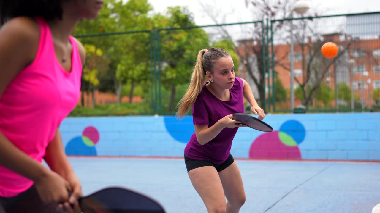 Women playing pickleball